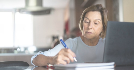 woman handwriting a document